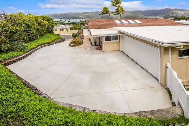 exterior space with a mountain view and a patio