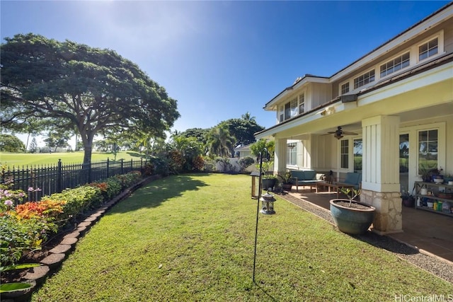 view of yard with ceiling fan