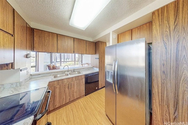 kitchen featuring sink, light hardwood / wood-style flooring, range with electric cooktop, black dishwasher, and stainless steel fridge with ice dispenser