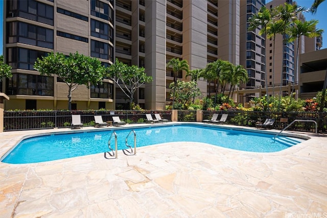 view of swimming pool with a patio area