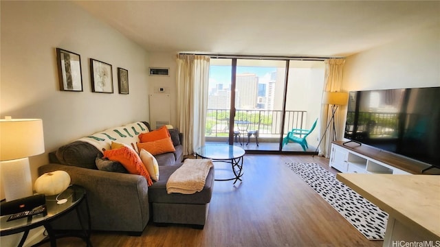 living room featuring expansive windows and wood finished floors