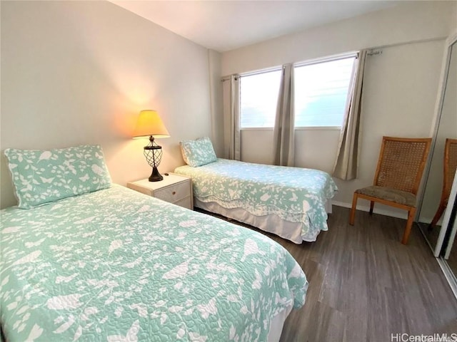 bedroom featuring dark hardwood / wood-style flooring