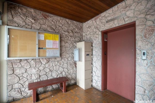 interior space featuring wooden ceiling and elevator