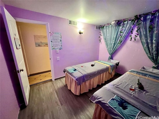 bedroom featuring wood-type flooring