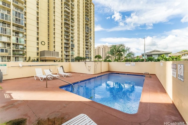 view of swimming pool with a patio