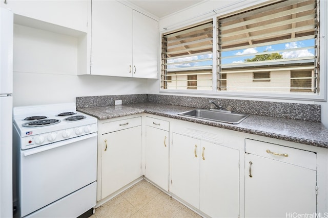 kitchen with electric stove, a wealth of natural light, white cabinets, and sink