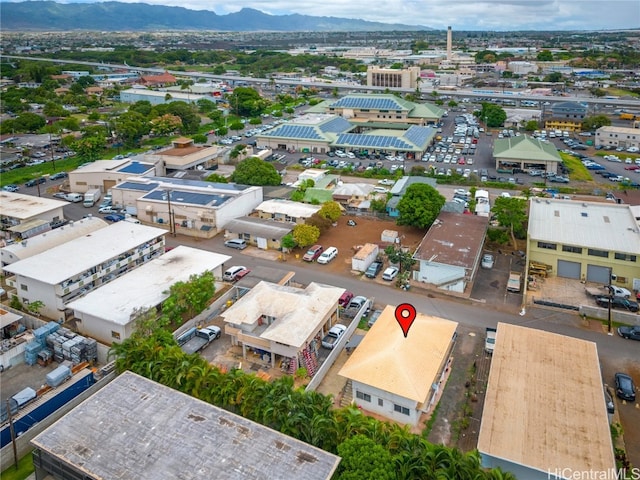 birds eye view of property with a mountain view