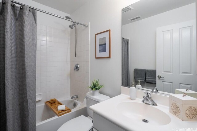 full bathroom with vanity, toilet, and shower / bath combination with curtain