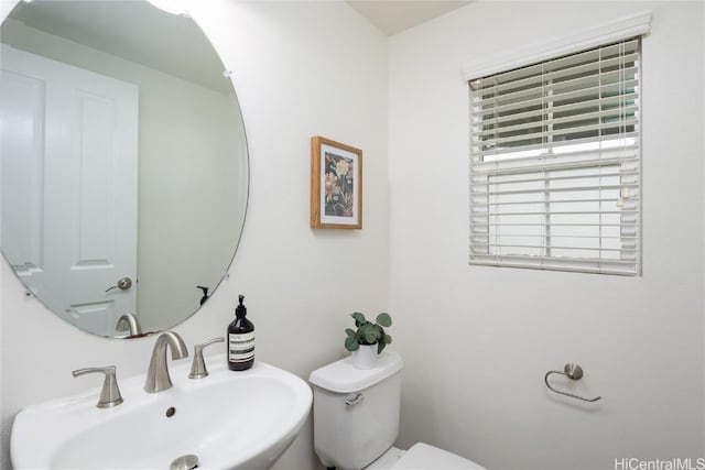 bathroom with sink and toilet