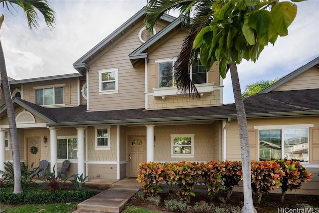 view of front of home featuring covered porch and roof with shingles