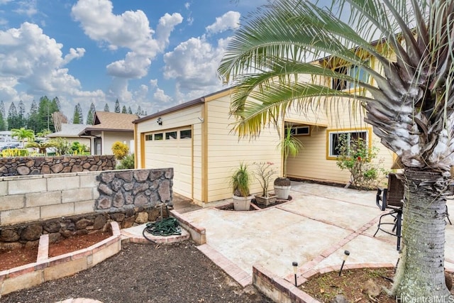 view of patio / terrace featuring a garage