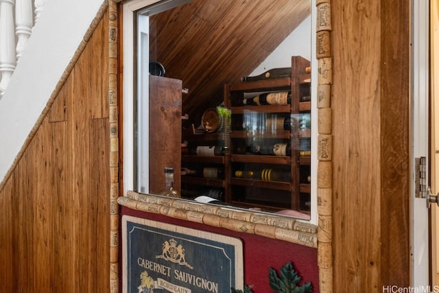 bar featuring vaulted ceiling and wooden ceiling