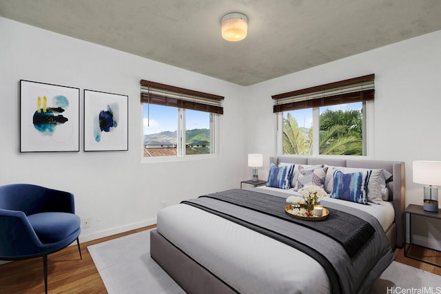 95-528 Awiki St, Mililani, HI 96789 - bedroom featuring baseboards and wood finished floors