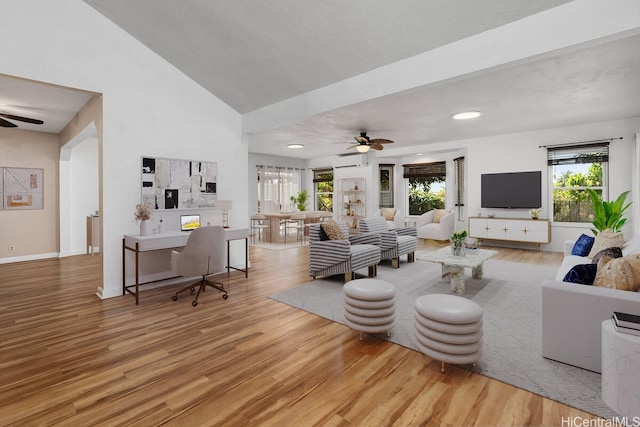 95-528 Awiki St, Mililani, HI 96789 - living room with a ceiling fan, wood finished floors, a wealth of natural light, and a wall mounted air conditioner