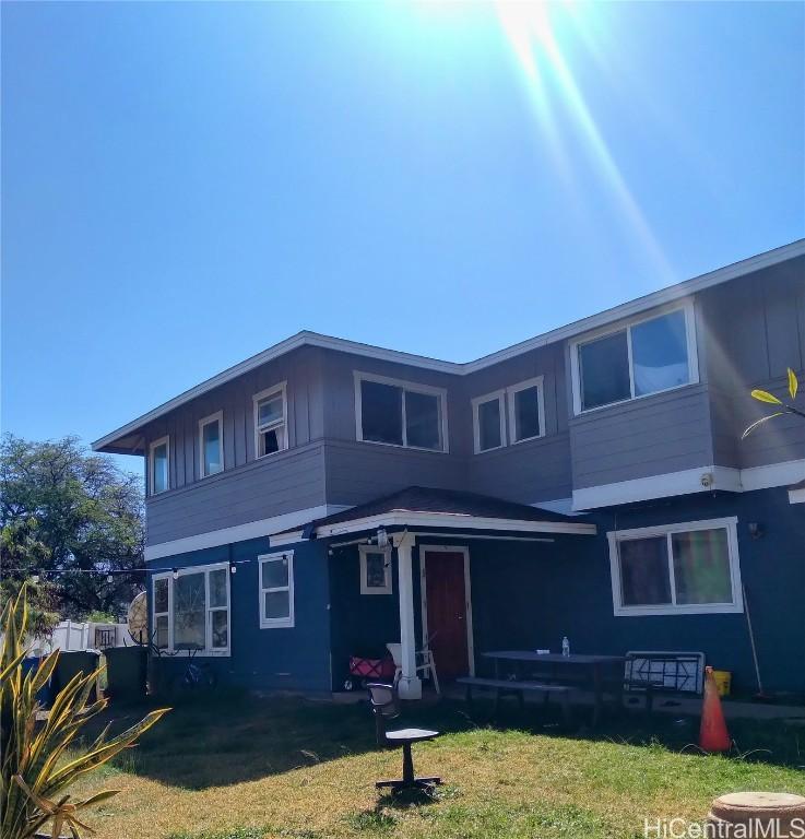 view of front of home with a front yard