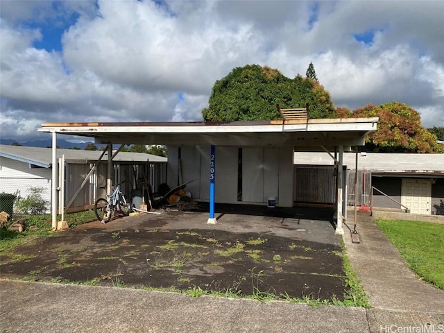 view of parking / parking lot with a carport