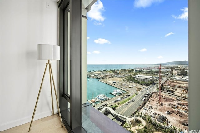 balcony featuring a water view