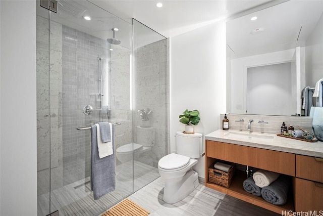 bathroom featuring walk in shower, vanity, toilet, tasteful backsplash, and tile patterned floors