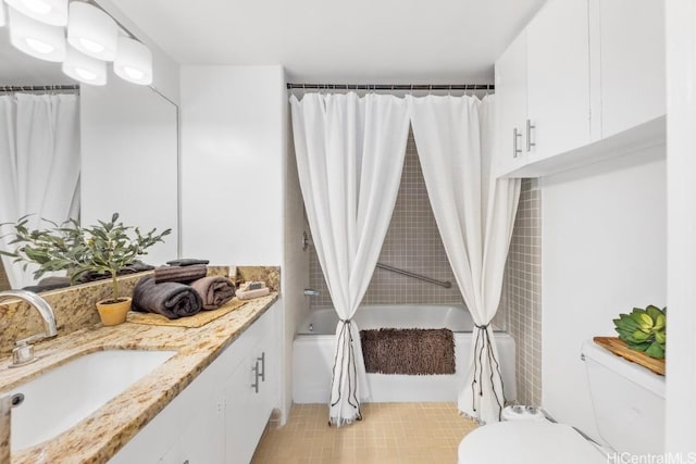 full bathroom with toilet, shower / bath combination with curtain, and vanity