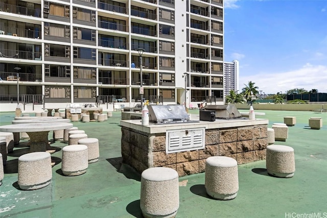 view of home's community featuring exterior kitchen