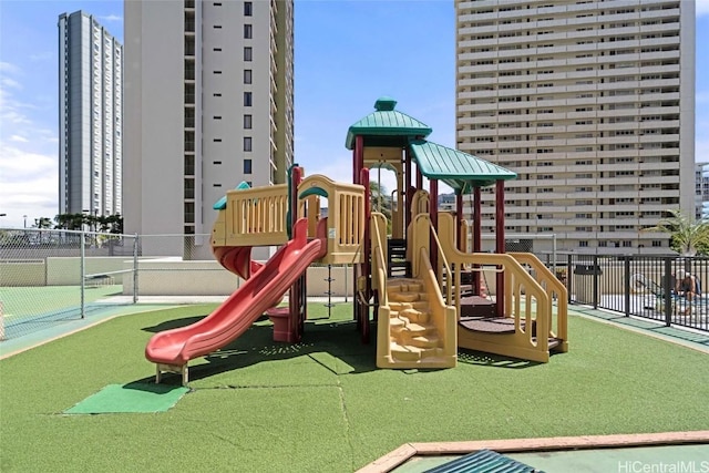 view of play area featuring tennis court