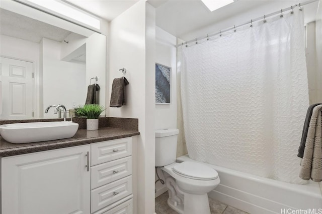 full bathroom with toilet, vanity, tile patterned flooring, and shower / bath combo with shower curtain