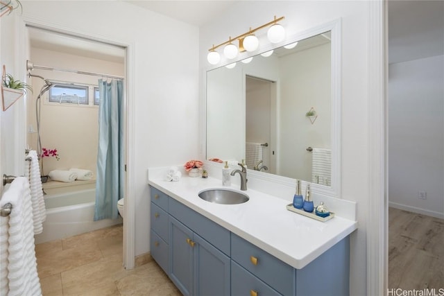 full bathroom with vanity, toilet, and shower / tub combo