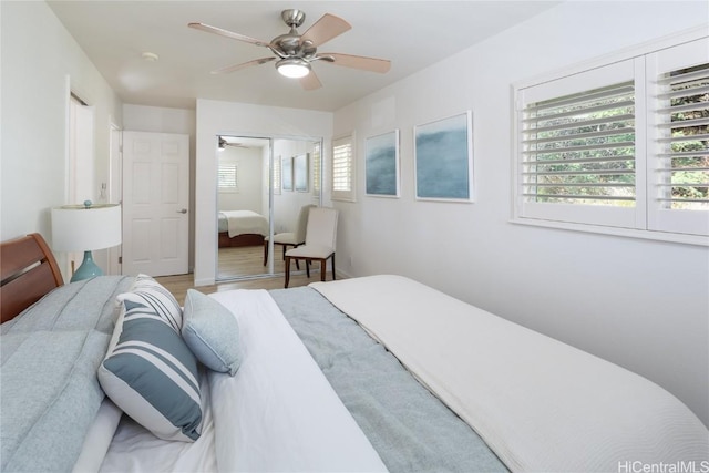 bedroom featuring ceiling fan and a closet