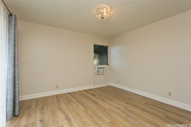 empty room with light hardwood / wood-style floors