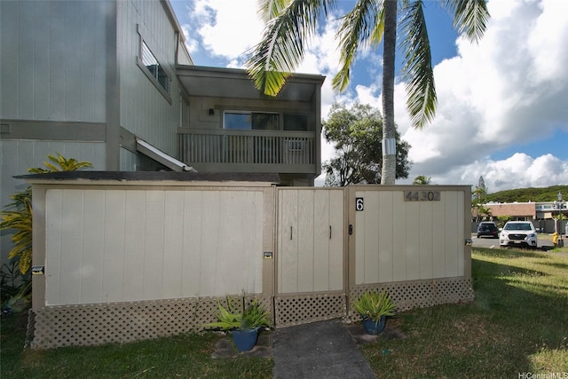 view of property exterior with a lawn
