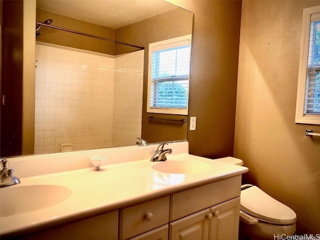 bathroom featuring toilet and vanity