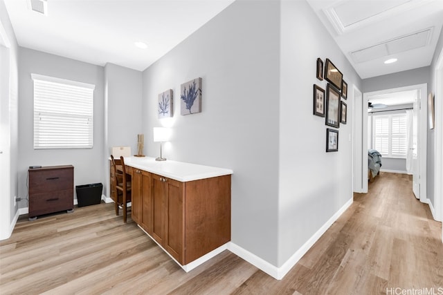 hallway with light hardwood / wood-style flooring