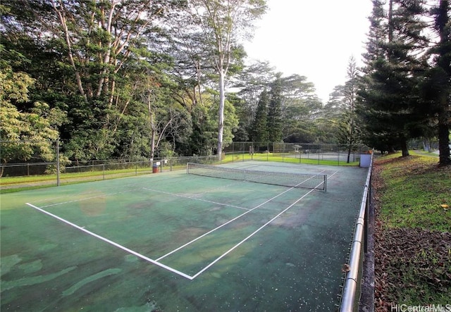 view of sport court with fence