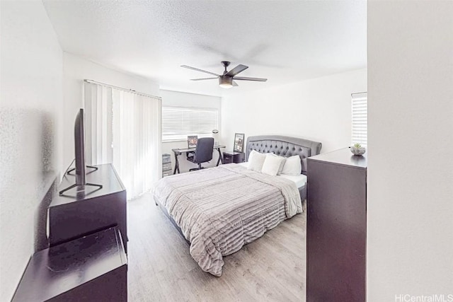 bedroom with wood finished floors and a ceiling fan