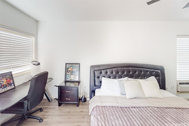 bedroom featuring wood finished floors and ceiling fan
