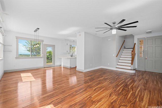 94-1092 Kikepa St Unit 179, Waipahu, HI 96797 - unfurnished living room featuring stairway, wood finished floors, and ceiling fan