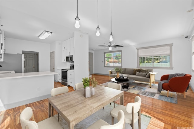 94-1092 Kikepa St Unit 179, Waipahu, HI 96797 - dining area with light wood-style flooring and ceiling fan