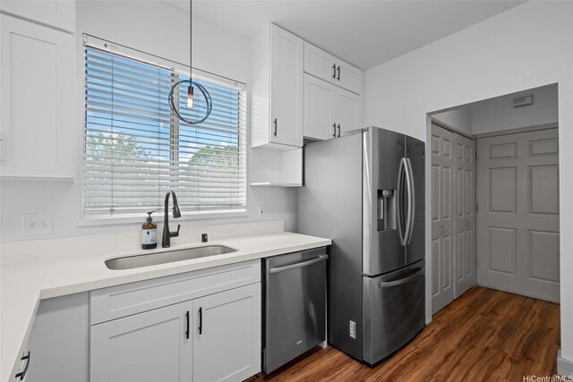 94-1092 Kikepa St Unit 179, Waipahu, HI 96797 - kitchen featuring appliances with stainless steel finishes, white cabinets, and dark wood-type flooring