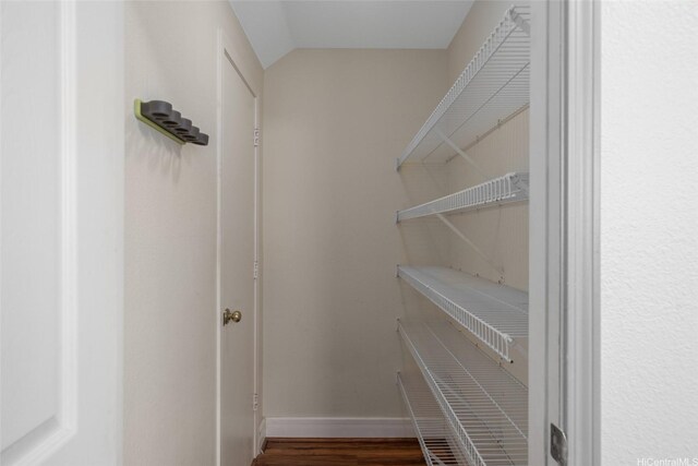 94-1092 Kikepa St Unit 179, Waipahu, HI 96797 - walk in closet featuring wood finished floors and lofted ceiling