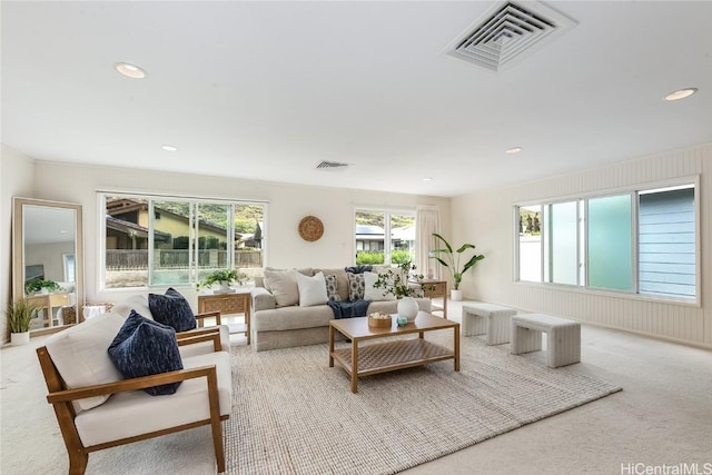 living room with carpet, visible vents, and recessed lighting