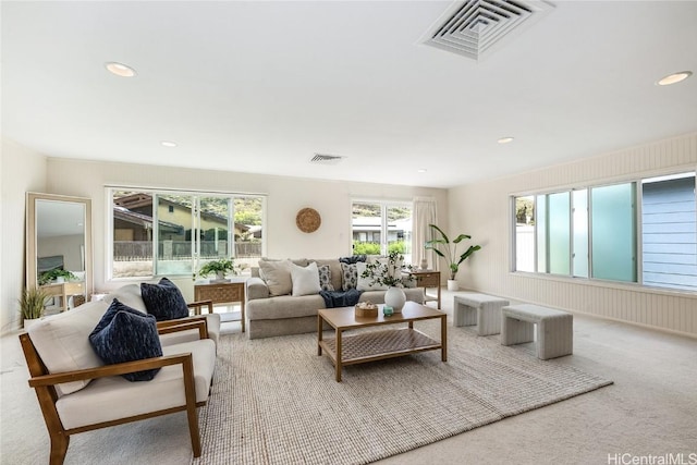 living room with visible vents, carpet flooring, and recessed lighting