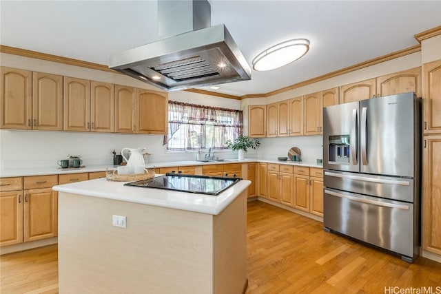 kitchen with extractor fan, light brown cabinets, black electric cooktop, ornamental molding, and stainless steel fridge