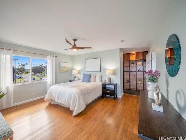 bedroom featuring ceiling fan and light hardwood / wood-style flooring