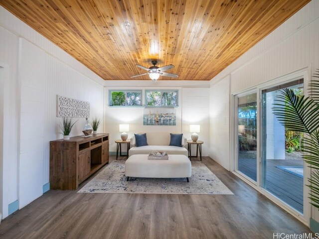 living area with wood ceiling, ceiling fan, and wood-type flooring