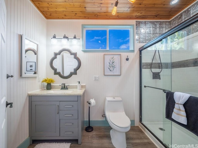 bathroom with hardwood / wood-style flooring, vanity, wood ceiling, and a shower with shower door