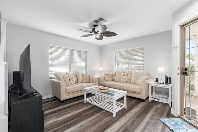 living room with ceiling fan, plenty of natural light, and dark hardwood / wood-style flooring