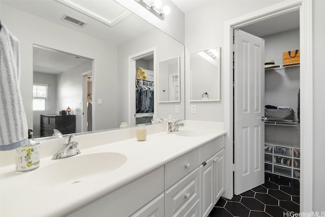 bathroom with tile patterned flooring and vanity