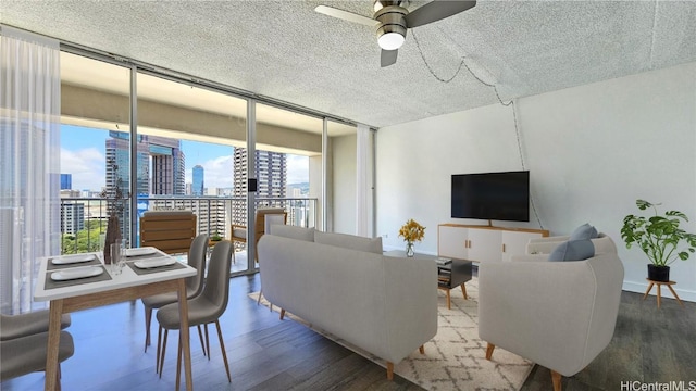 living room with a wall of windows, ceiling fan, and wood-type flooring