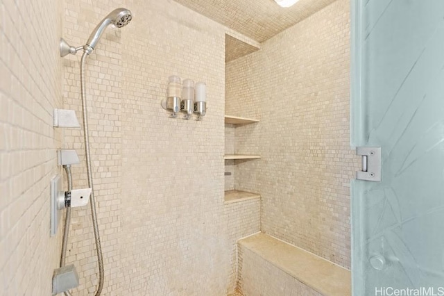 bathroom with a tile shower