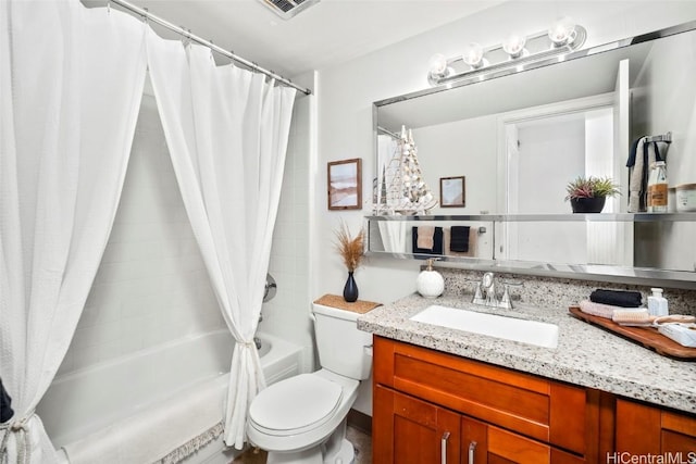 full bathroom with vanity, toilet, and shower / tub combo with curtain